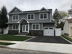 boulder creek faststak lasino cultured stone under window bluestone lip capping around door steps stoop walkway brick paver asphalt drive